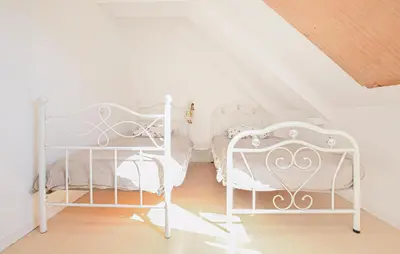 Un ou plusieurs lits dans un hébergement de l'établissement Maison Entre Terre Et Mer