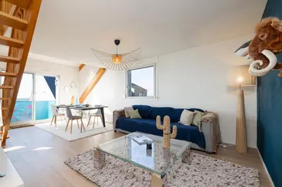 Coin salon dans l'établissement LES DUNES Duplex-Plage Jullouville
