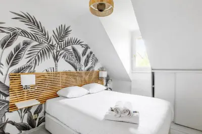Un ou plusieurs lits dans un hébergement de l'établissement Comfortable stay with sea view in Cabourg
