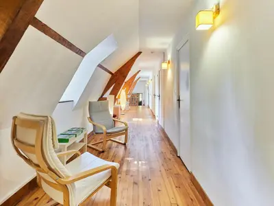 Coin salon dans l'établissement Holiday Home Le Pressoir de la laize by Interhome