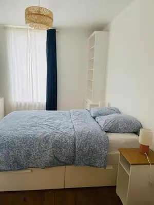 Un ou plusieurs lits dans un hébergement de l'établissement Appartement dans le centre de saint pair à 5 min de la plage