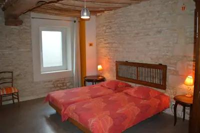 Un ou plusieurs lits dans un hébergement de l'établissement Ma maison de famille, grange du 18e siècle, jardin