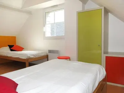 Un ou plusieurs lits dans un hébergement de l'établissement VVF Camping Les Dunes Créances - Plage du Cotentin
