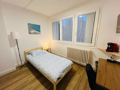 Un ou plusieurs lits dans un hébergement de l'établissement Studio cosy près du centre Nordblue