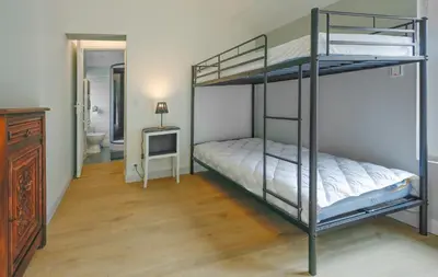 Un ou plusieurs lits dans un hébergement de l'établissement La maison au cœur médiéval
