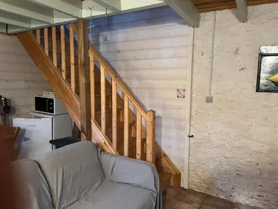 Télévision ou salle de divertissement dans l'établissement La cabane du pêcheur