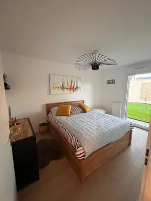 Un ou plusieurs lits dans un hébergement de l'établissement Calme et luxe dans une cité balnéaire