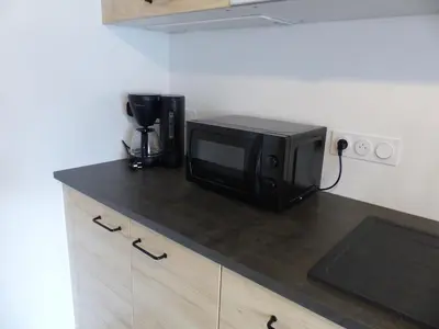 Cuisine ou kitchenette dans l'établissement Appartement cozy