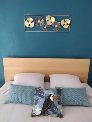Un ou plusieurs lits dans un hébergement de l'établissement Maison centre Arromanches Acces direct Plage