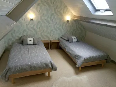 Un ou plusieurs lits dans un hébergement de l'établissement Maison centre Arromanches Acces direct Plage