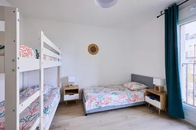 Un ou plusieurs lits dans un hébergement de l'établissement Entre Ciel et Mer - Proche Plage