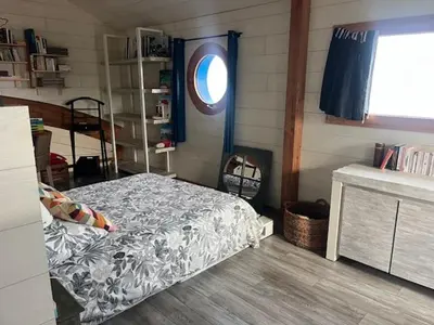 Un ou plusieurs lits dans un hébergement de l'établissement Villa rhum omaha beach
