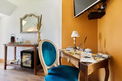 Télévision ou salle de divertissement dans l'établissement Le Hamelinet