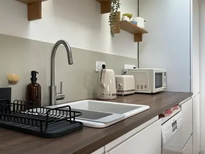Cuisine ou kitchenette dans l'établissement La Maison Rose - Ciel by Melrose