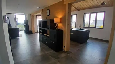 Télévision ou salle de divertissement dans l'établissement Au bon coin de la baie