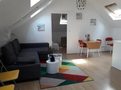 Coin salon dans l'établissement Un nid cosy sous les toits