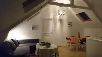 Coin salon dans l'établissement Un nid cosy sous les toits