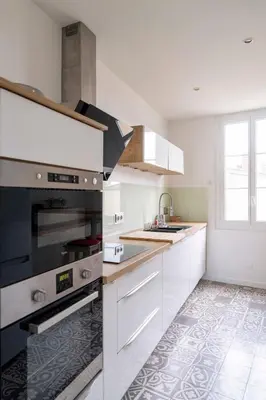 Cuisine ou kitchenette dans l'établissement Triplex de charme en hypercentre de Caen