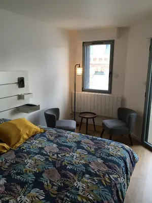 Un ou plusieurs lits dans un hébergement de l'établissement Carteret centre, port avec balcon vue mer