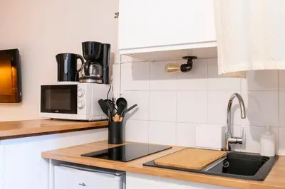 Cuisine ou kitchenette dans l'établissement Studio proche centre-ville et université