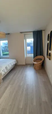 Un ou plusieurs lits dans un hébergement de l'établissement Maison rénovée avec stationnement privatif
