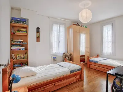 Un ou plusieurs lits dans un hébergement de l'établissement Maison de vacances à 100m de la plage, jardin, séjour convivial - FR-1-788-97