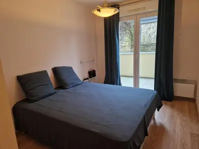 Un ou plusieurs lits dans un hébergement de l'établissement Appartement 2 Chambres - Bord de mer - Wi-Fi