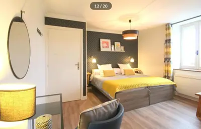 Un ou plusieurs lits dans un hébergement de l'établissement Grand gîte de la Ferme De La Tourelle