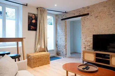 Télévision ou salle de divertissement dans l'établissement Duplex de charme dans le quartier du Vaugueux