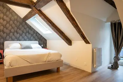 Un ou plusieurs lits dans un hébergement de l'établissement Duplex de charme dans le quartier du Vaugueux