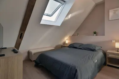 Un ou plusieurs lits dans un hébergement de l'établissement Les Trois Rois 5 - Centre Avranches