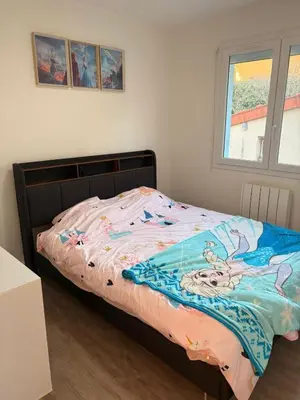 Un ou plusieurs lits dans un hébergement de l'établissement Appartement familial Disney proche de la mer