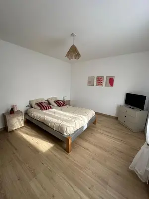 Un ou plusieurs lits dans un hébergement de l'établissement Gîte bord de mer