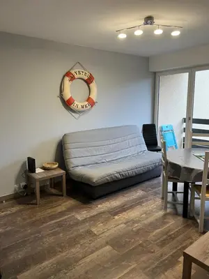 Coin salon dans l'établissement Appartement Cabourg