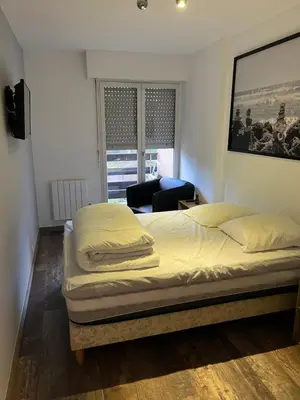 Un ou plusieurs lits dans un hébergement de l'établissement Appartement Cabourg