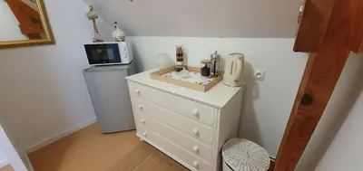 Cuisine ou kitchenette dans l'établissement Maison des Hortensias