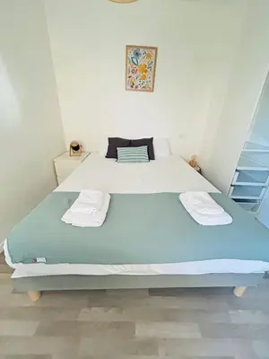 Un ou plusieurs lits dans un hébergement de l'établissement Appartement proche université