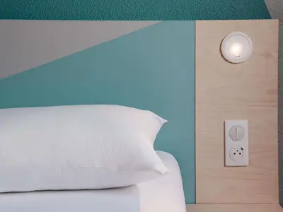 Un ou plusieurs lits dans un hébergement de l'établissement Ibis Budget Pontorson Baie Du Mont Saint Michel