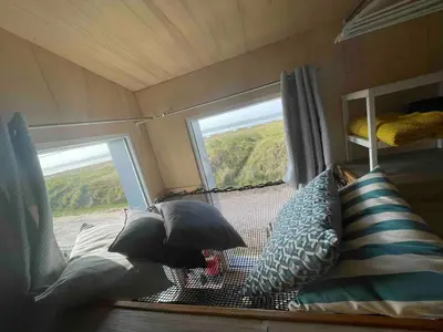 Un ou plusieurs lits dans un hébergement de l'établissement Week end romantique en Normande dans une cabane en front de mer