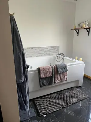 Un ou plusieurs lits dans un hébergement de l'établissement Ô Chalet Normand