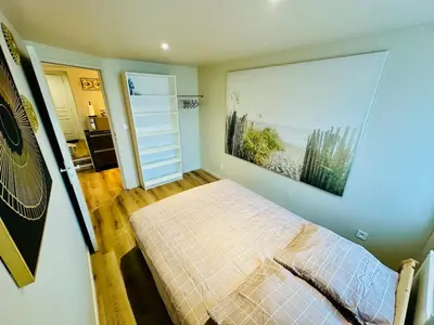 Un ou plusieurs lits dans un hébergement de l'établissement Appartement moderne et chaleureux