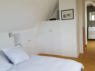 Un ou plusieurs lits dans un hébergement de l'établissement Holiday Home Charmantes Holzhaus in einer grünen Umgebung by Interhome