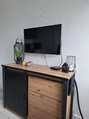Télévision ou salle de divertissement dans l'établissement L'Appart Bayeux