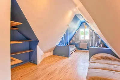 Un ou plusieurs lits dans un hébergement de l'établissement Charming little townhouse by the sea