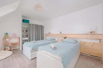 Un ou plusieurs lits dans un hébergement de l'établissement L'Albatros - Maison de vacances