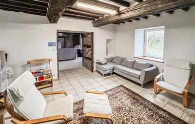 Coin salon dans l'établissement Gîte Le Maliverney