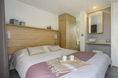 Un ou plusieurs lits dans un hébergement de l'établissement Cottage Nautilus 4p 2Bdrms AirConPremium
