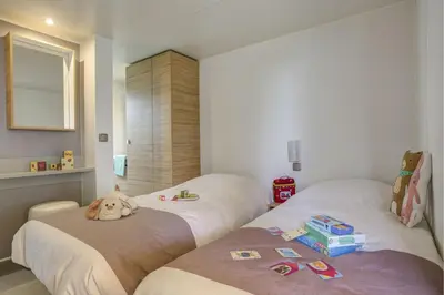 Un ou plusieurs lits dans un hébergement de l'établissement Cottage Nautilus 4p 2Bdrms AirConPremium