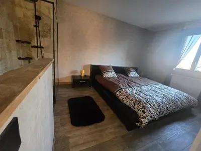 Un ou plusieurs lits dans un hébergement de l'établissement Maison en Normande