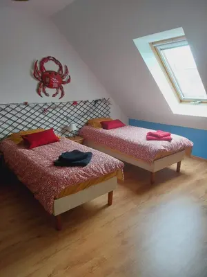 Un ou plusieurs lits dans un hébergement de l'établissement Le charme du cotentin, votre havre de paix pour les vacances